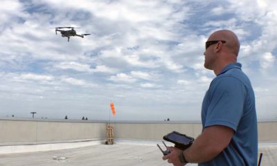 Photo of a drone and its operator