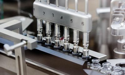 Photo of rubber stoppers placed onto vials