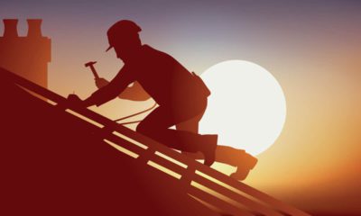 photo of a roofer working under the early evening sun