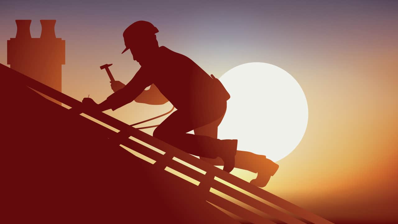 photo of a roofer working under the early evening sun